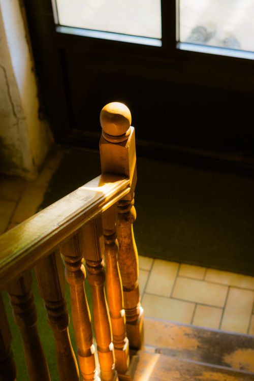 Free Warm sunlight illuminates a wooden staircase in Ohrid, creating a cozy atmosphere. Stock Photo