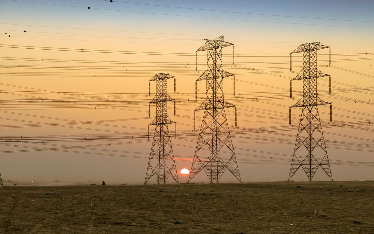 High Voltage Towers at Sunset Silhouette · Free Stock Photo