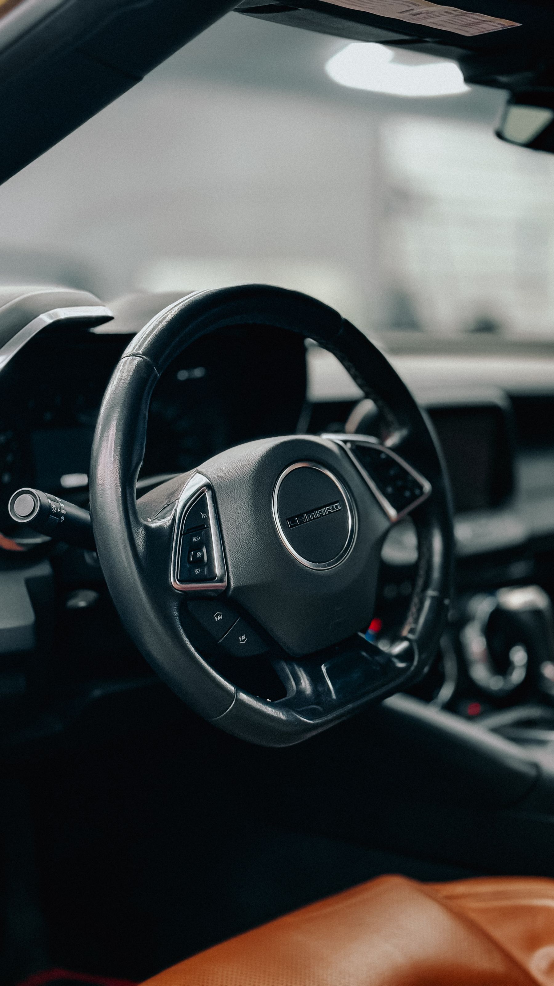 Custom carbon fiber steering wheel close-up