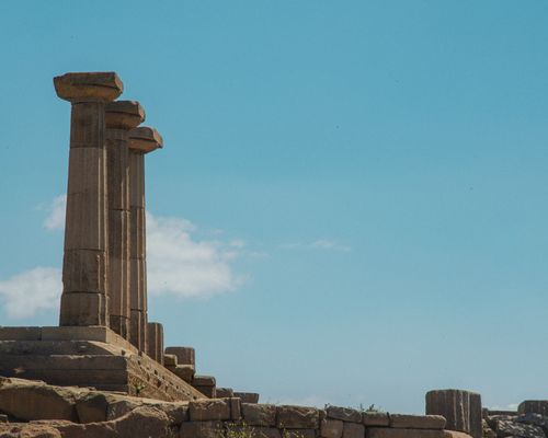 Free Majestic view of columns at Assos Temple of Athena under clear blue sky. Stock Photo