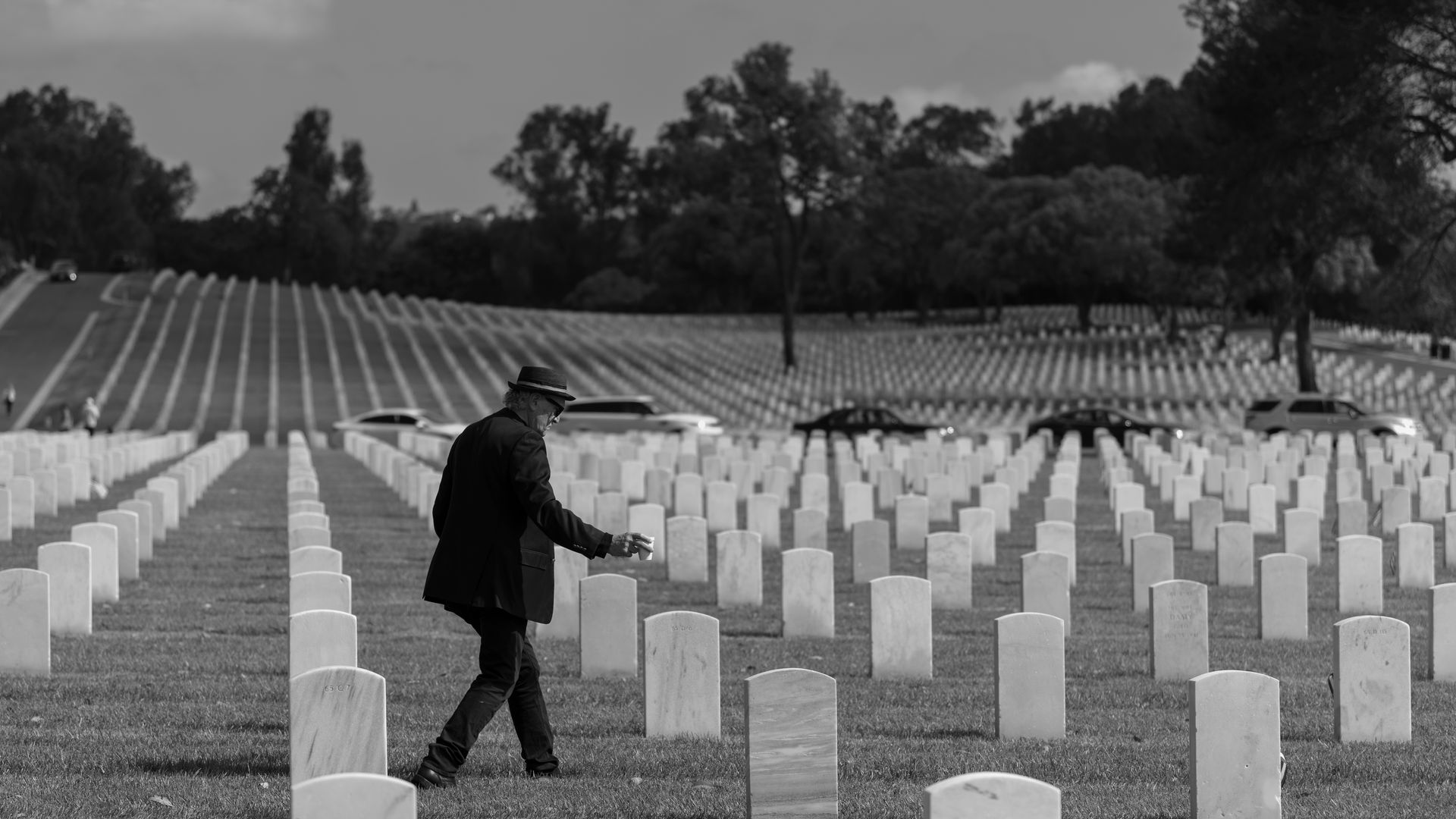 Best Modafinil Vendor 2026: Finding Reliable Sources A man walks through a cemetery in Los Angeles, California, amidst rows of headstones, capturing a reflective moment.