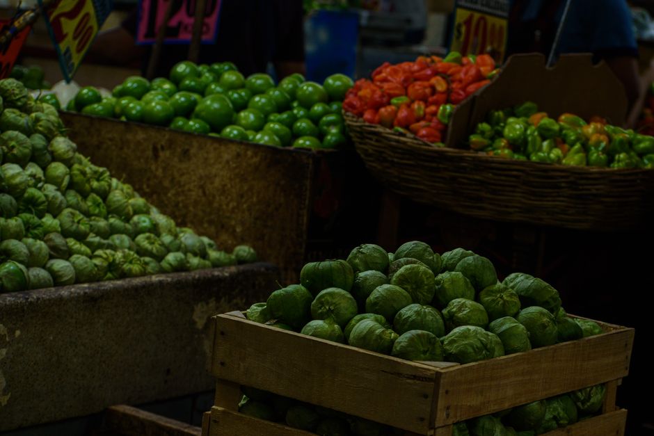 A colorful display of fresh vegetables at a bustling market in Ciudad de México.
