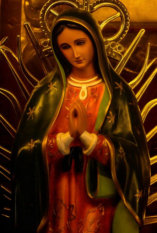 Free A detailed image of the Virgin of Guadalupe statue inside a church, symbolizing faith and spirituality. Stock Photo