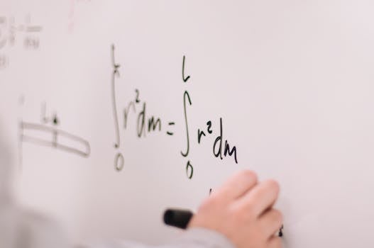 Person Writing On White Board