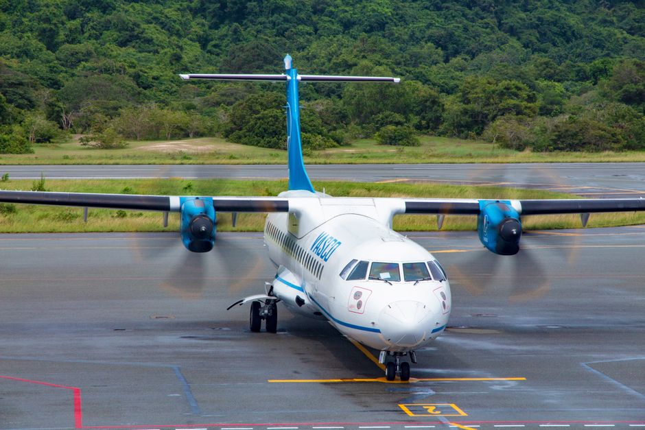 modern regional turboprop aircraft on airport tarmac