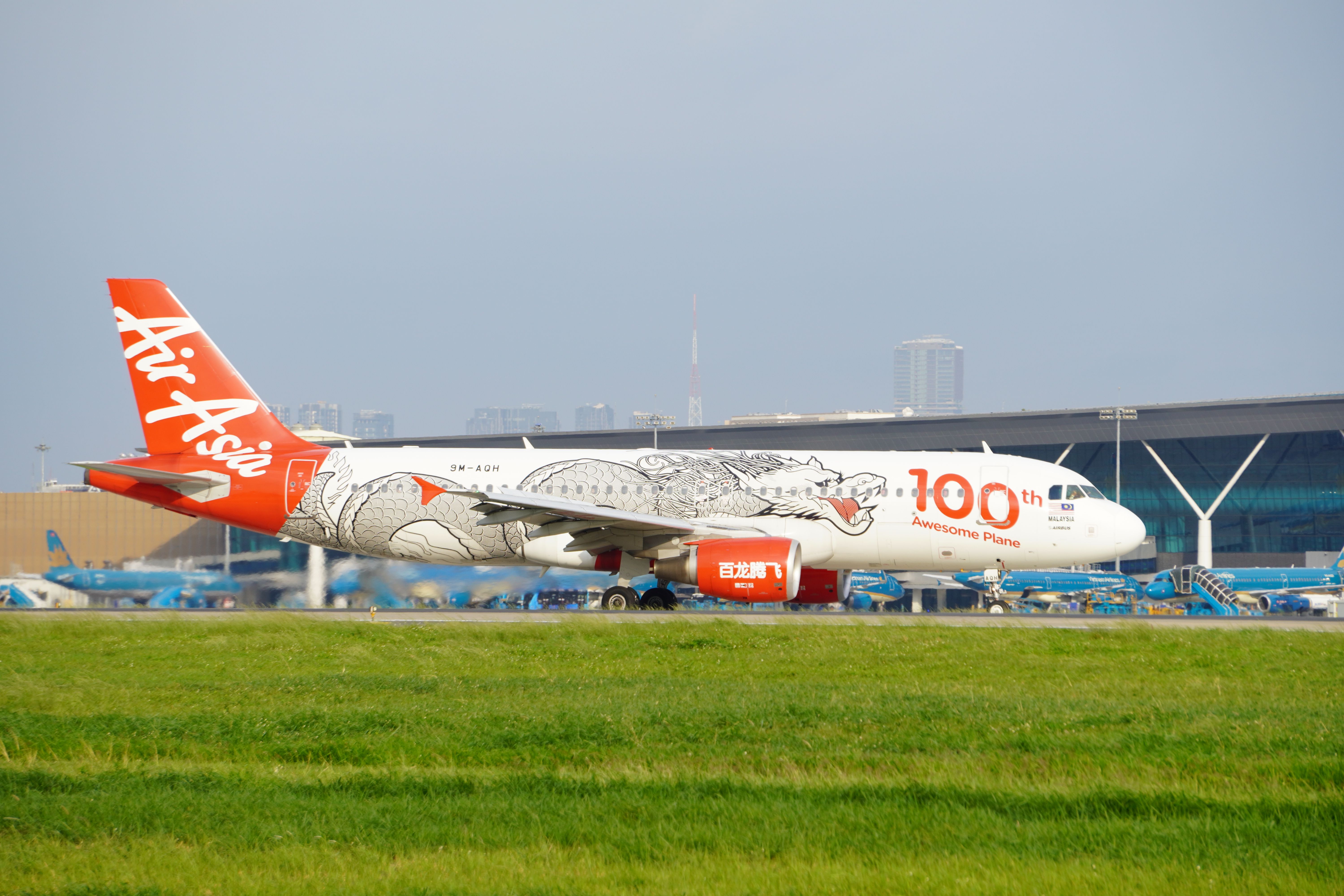 AirAsia aircraft parked at an airport gate in Cambodia
