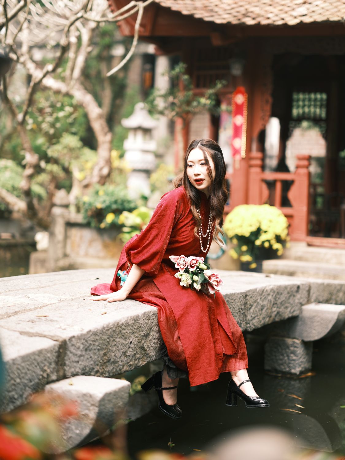 Elegant Woman in Red Dress at Traditional Garden · Free Stock Photo