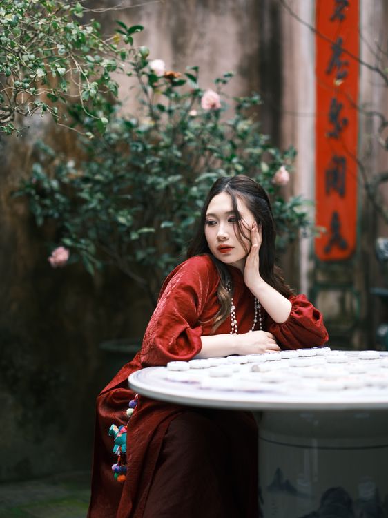 Elegant Woman in Traditional Red Dress Outdoors · Free Stock Photo