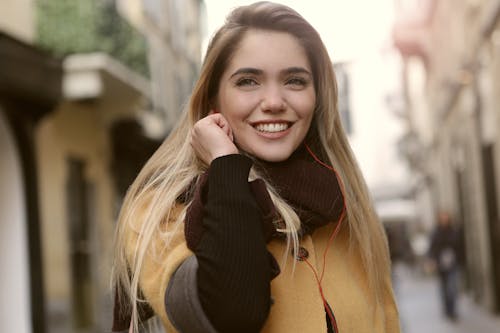 Smiling Woman in Black Knit Sweater