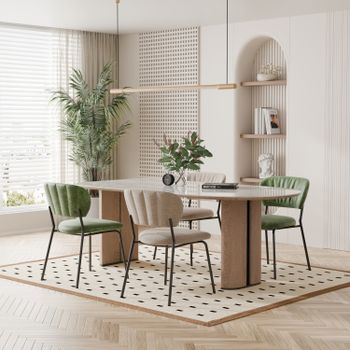 Stylish dining room with modern furniture, green accents, and natural light.