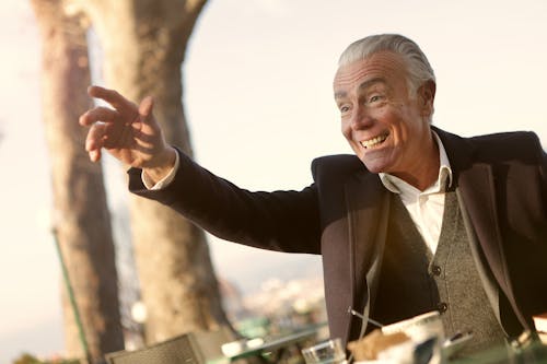 Man In Black Suit Smiling