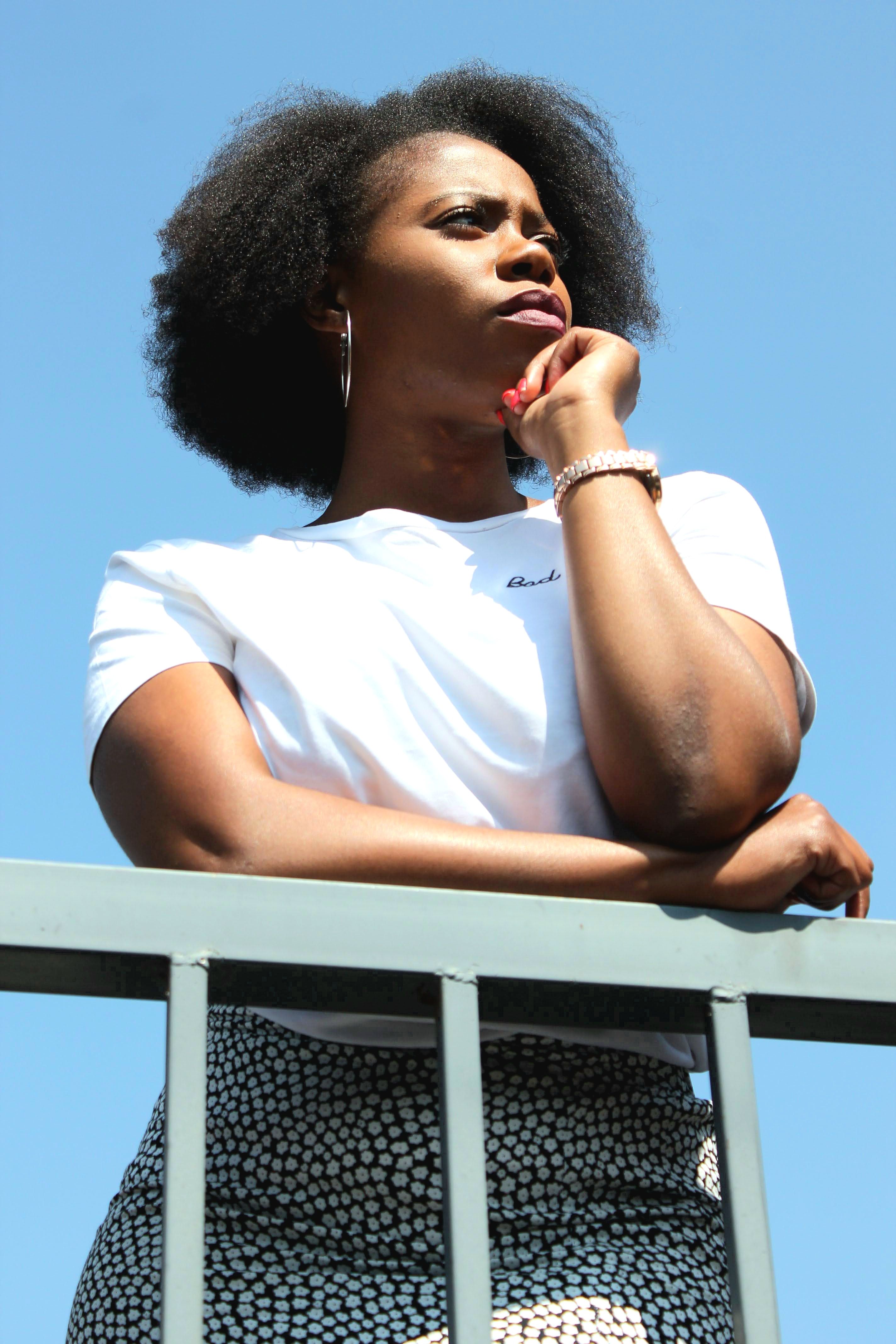Portrait of a thoughtful woman in Johannesburg enjoying a sunny day.