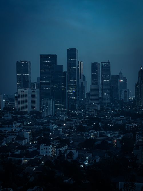 Free A mesmerizing view of Jakarta's skyline at night, showcasing towering skyscrapers and city lights. Stock Photo