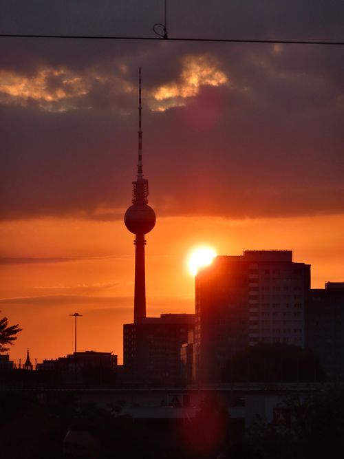 Free Silhouette of Berlin's skyline with the iconic TV Tower at sunset. Stock Photo