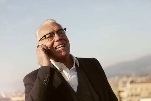 Man In Black Suit Wearing Eyeglasses