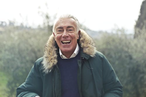 Adult Man Wearing Green Jacket
