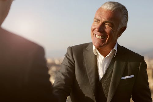 Man In Black Suit Smiling