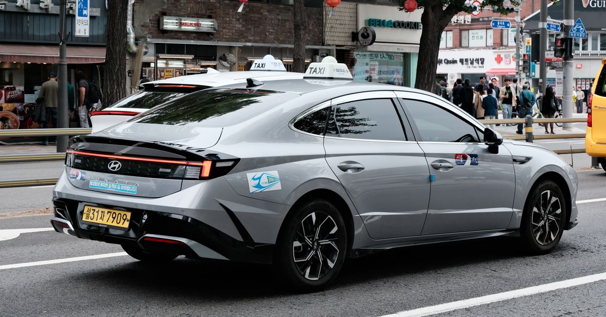 Hyundai taxi on a busy Seoul street for Korea ride-hailing guidance