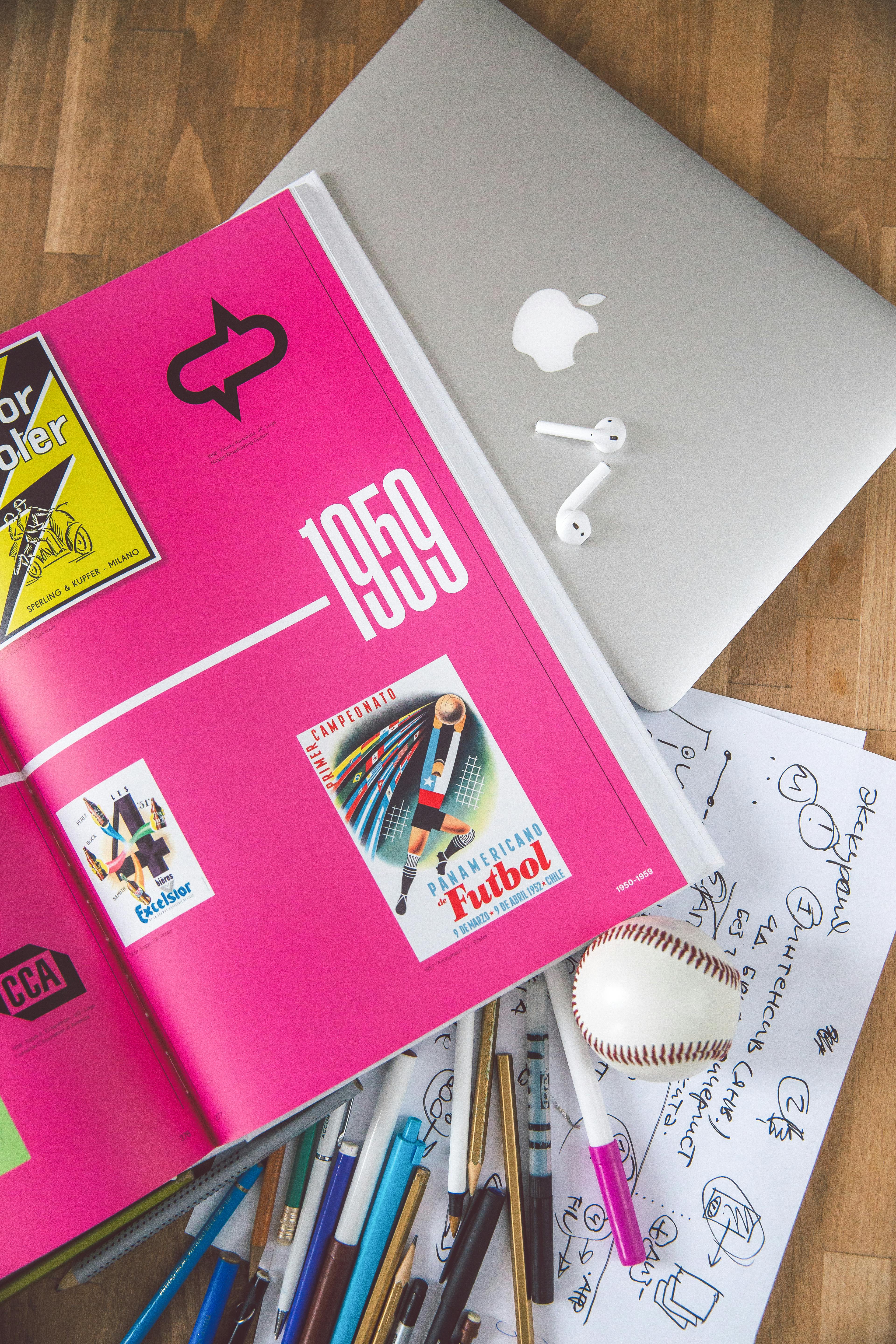Laptop and Book on Table · Free Stock Photo