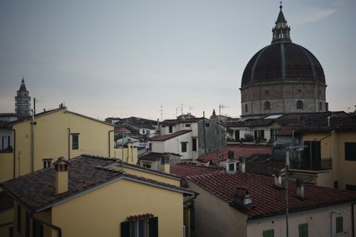 Free Charming rooftop view of Pistoia, featuring classic architecture and cathedral dome. Stock Photo