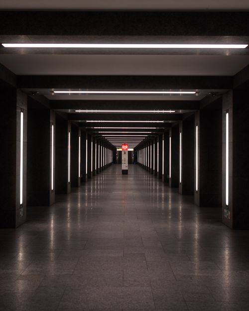 Free Empty underground passageway with symmetrical light design and modern architecture. Stock Photo