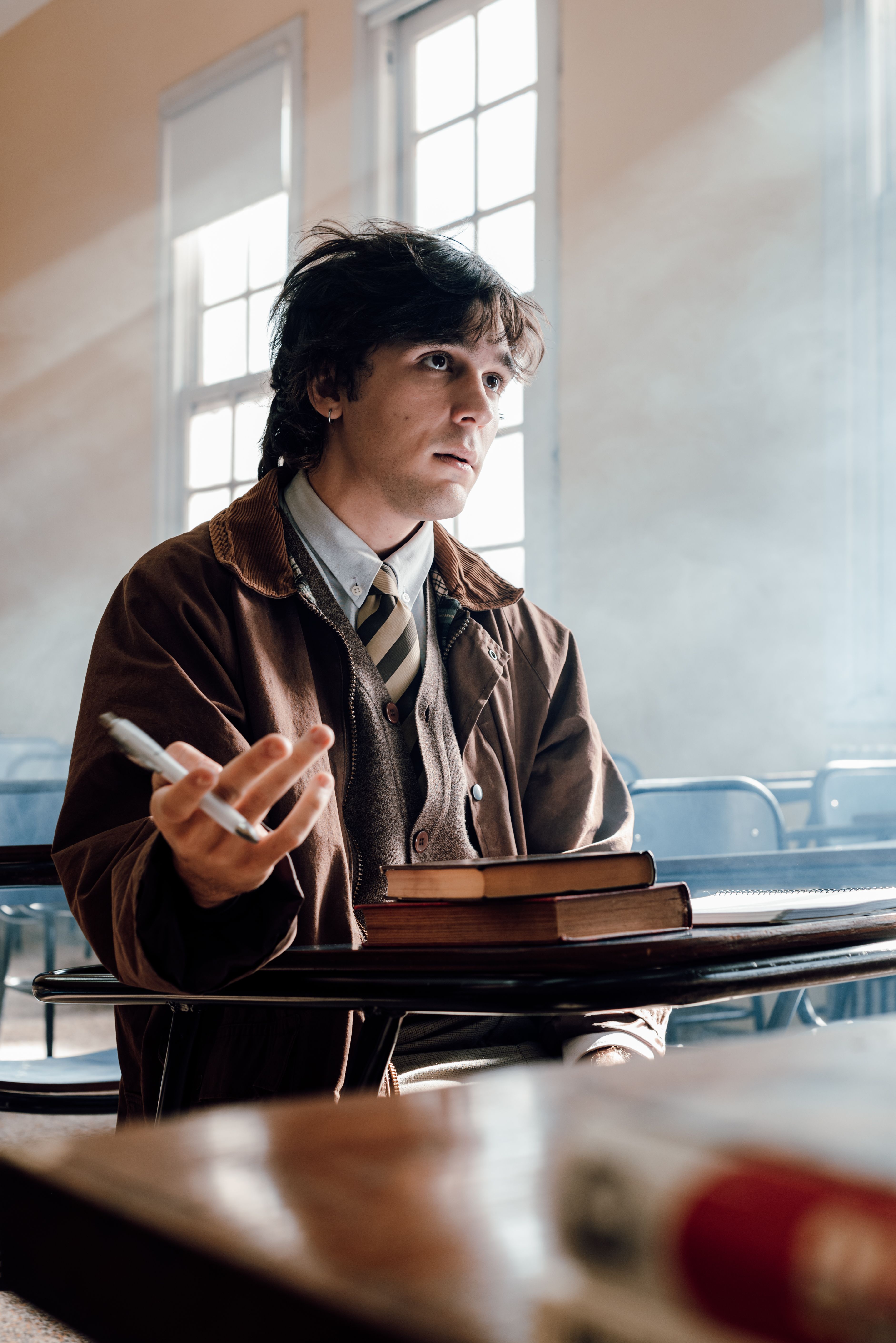 A university student sits thoughtfully in a classroom in Buenos Aires, Argentina.