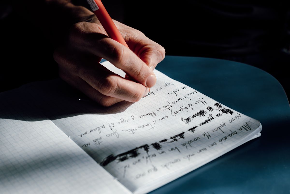 Indian student correcting common German grammar mistakes in a notebook