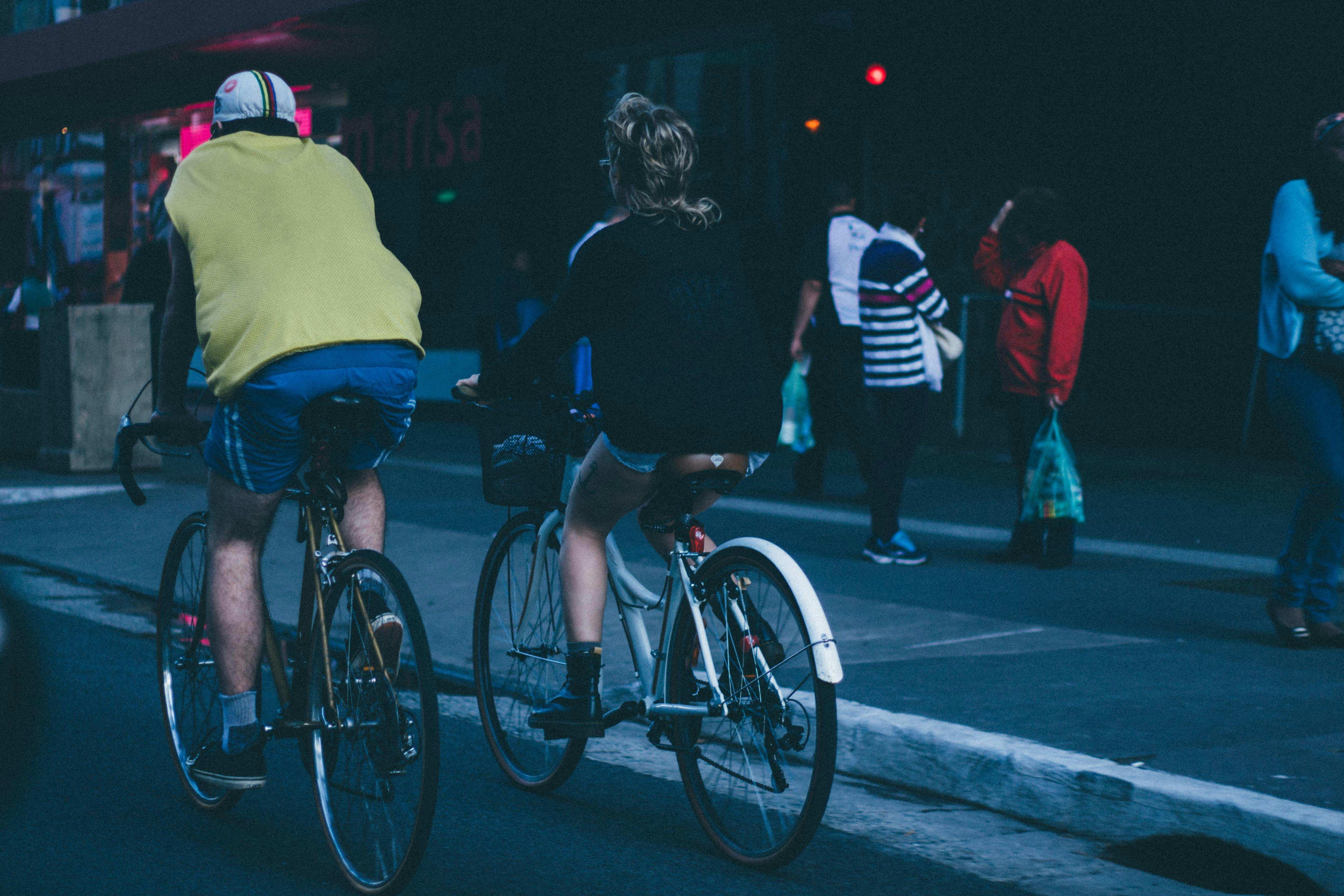 Two Person Riding on Bicycle Beside Sidewalk · Free Stock Photo