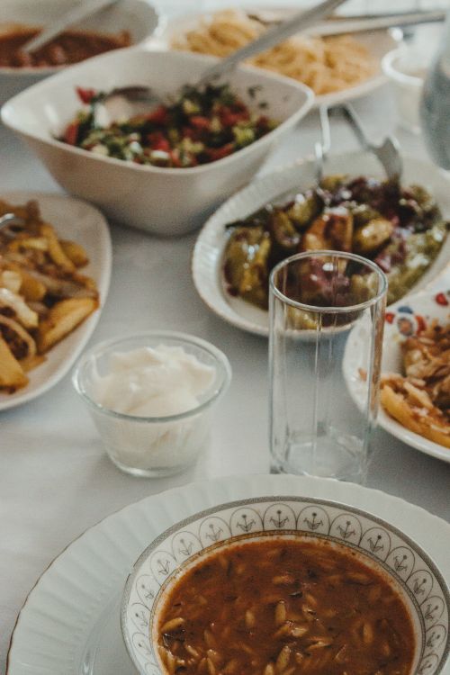 Free An assortment of Middle Eastern dishes on a table, featuring salads, stuffed vegetables, and traditional soups. Stock Photo