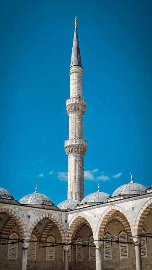 Free Beautiful view of the Süleymaniye Mosque minaret under a clear blue sky in Istanbul. Stock Photo