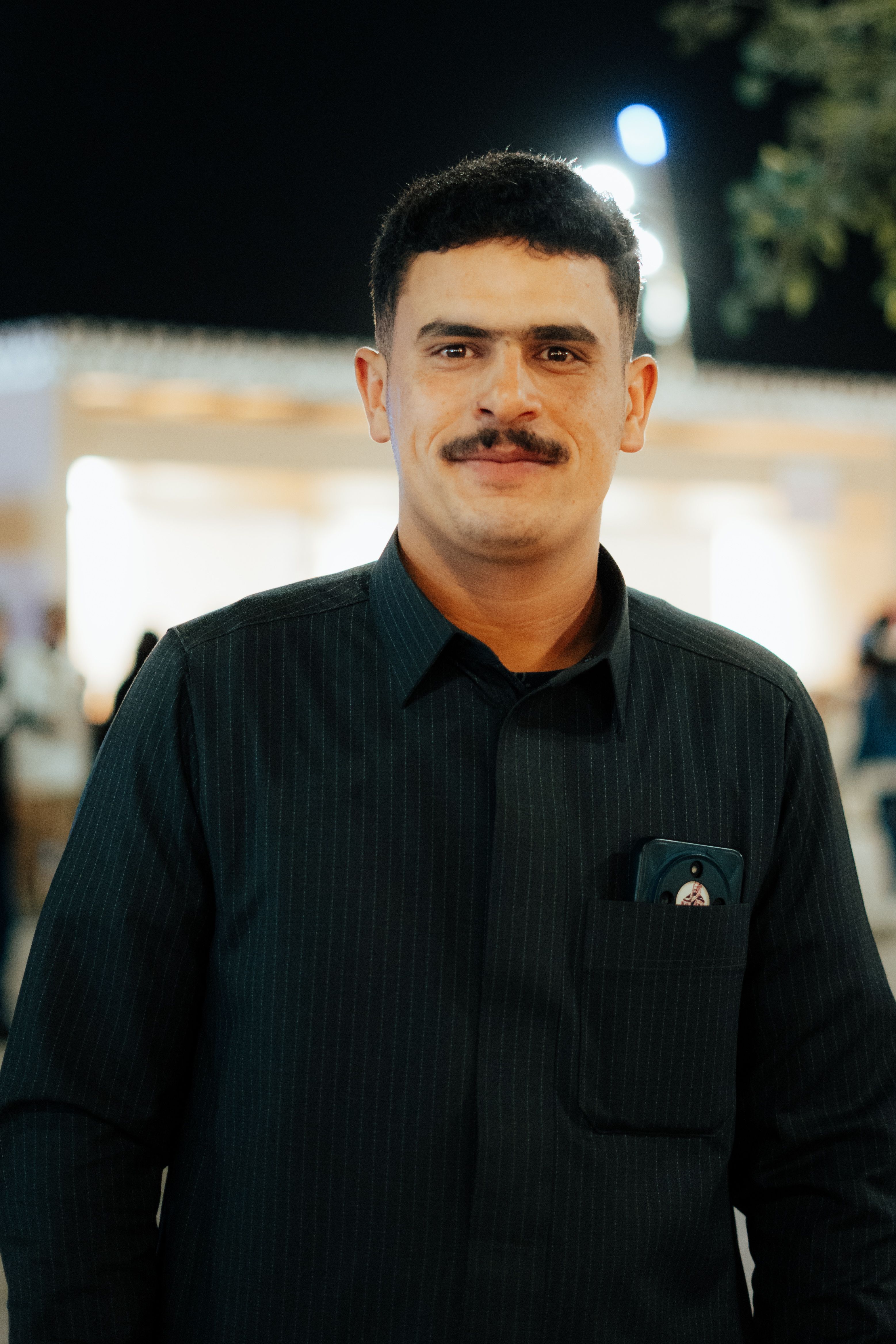 Casual Portrait of a Man at Night Event