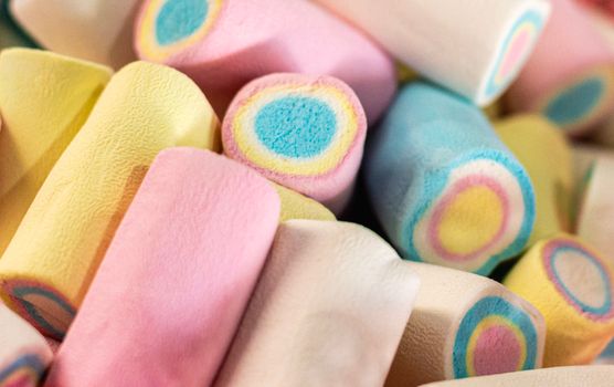 Close-up of colorful pastel marshmallows, perfect for parties and sweet treats.