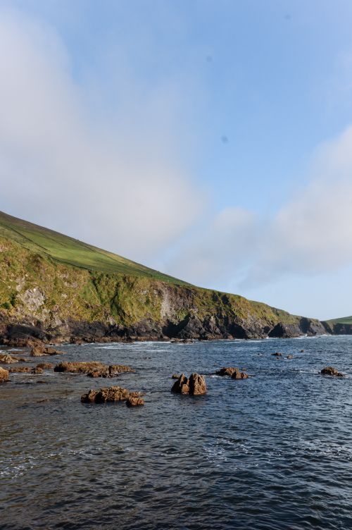 Free Breathtaking view of the rocky coast and cliffs in Dingle, Ireland under a clear sky. Stock Photo