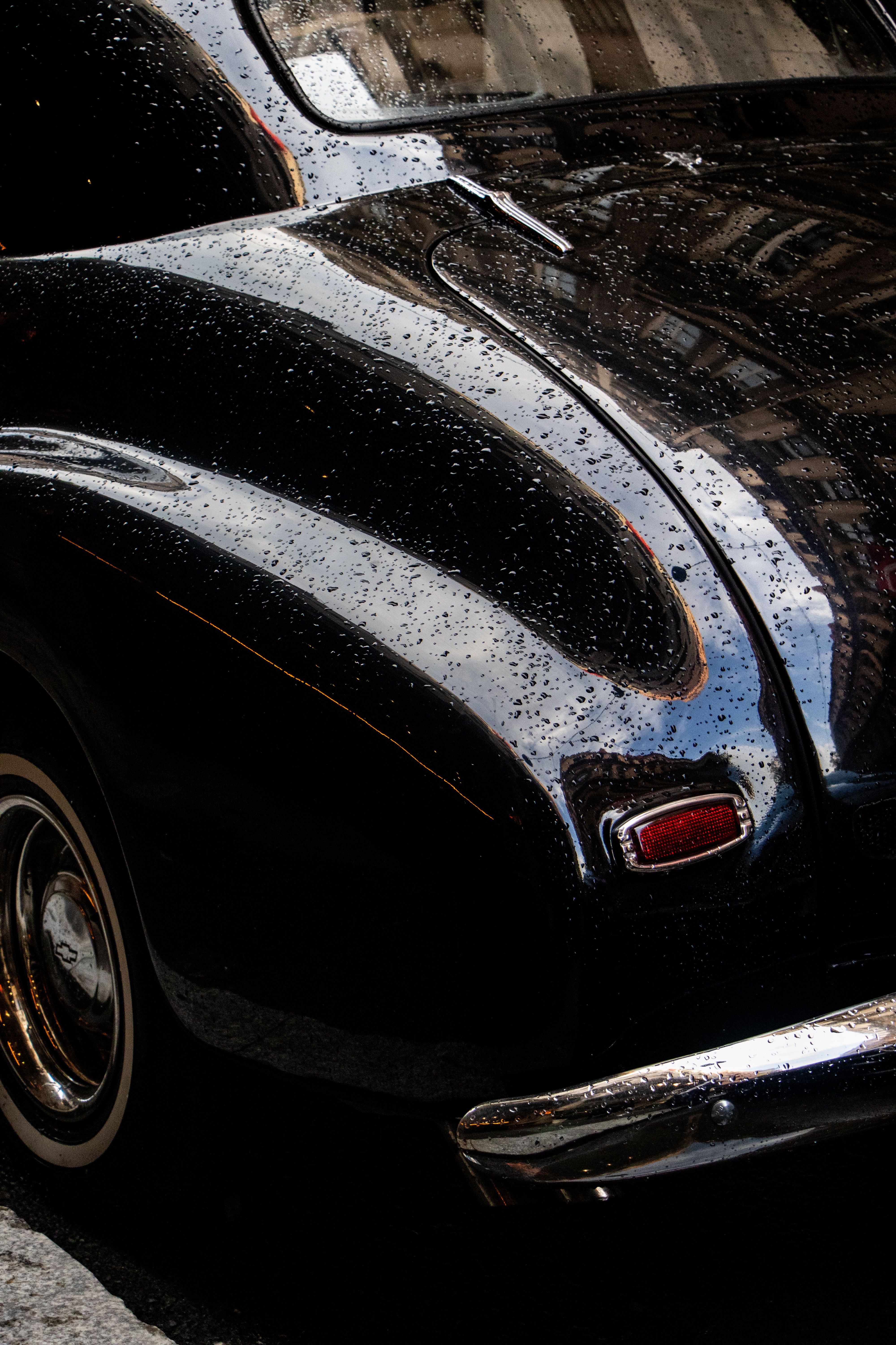 Glossy rain sheen on treated car paint surface