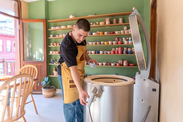 Kiln loading in a pottery studio — Onur Burak Akın on Pexels