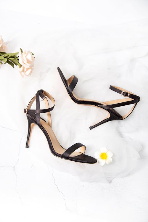 Free Black and Brown Open Toe Ankle Strap Heeled Sandals Stock Photo