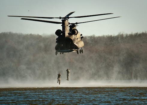 Gray Helicopter Above Body of Water
