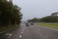 A blurred highway view during a rainy day drive in NSW, Australia, capturing nature and road travel.