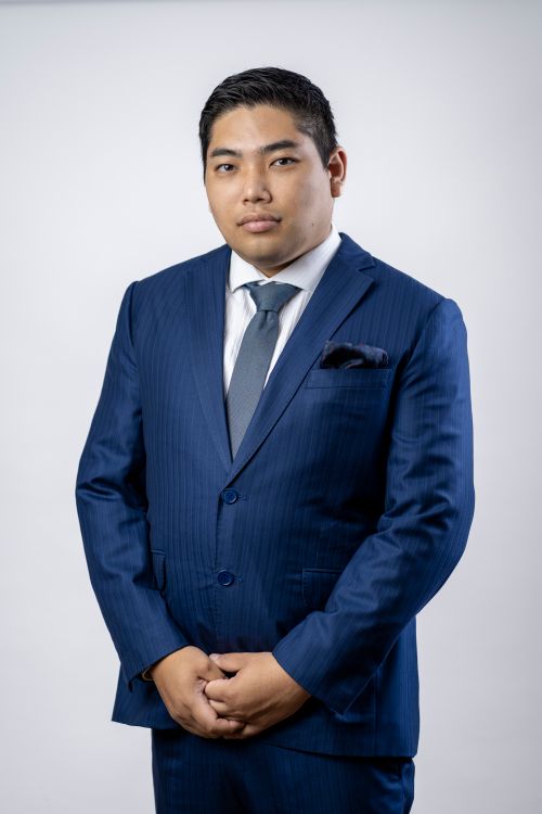 Free Formal portrait of a businessman in a blue suit with a white background, exuding confidence and professionalism. Stock Photo