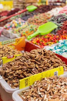 Vibrant nuts and candies on display at a lively market in Ciudad de México.