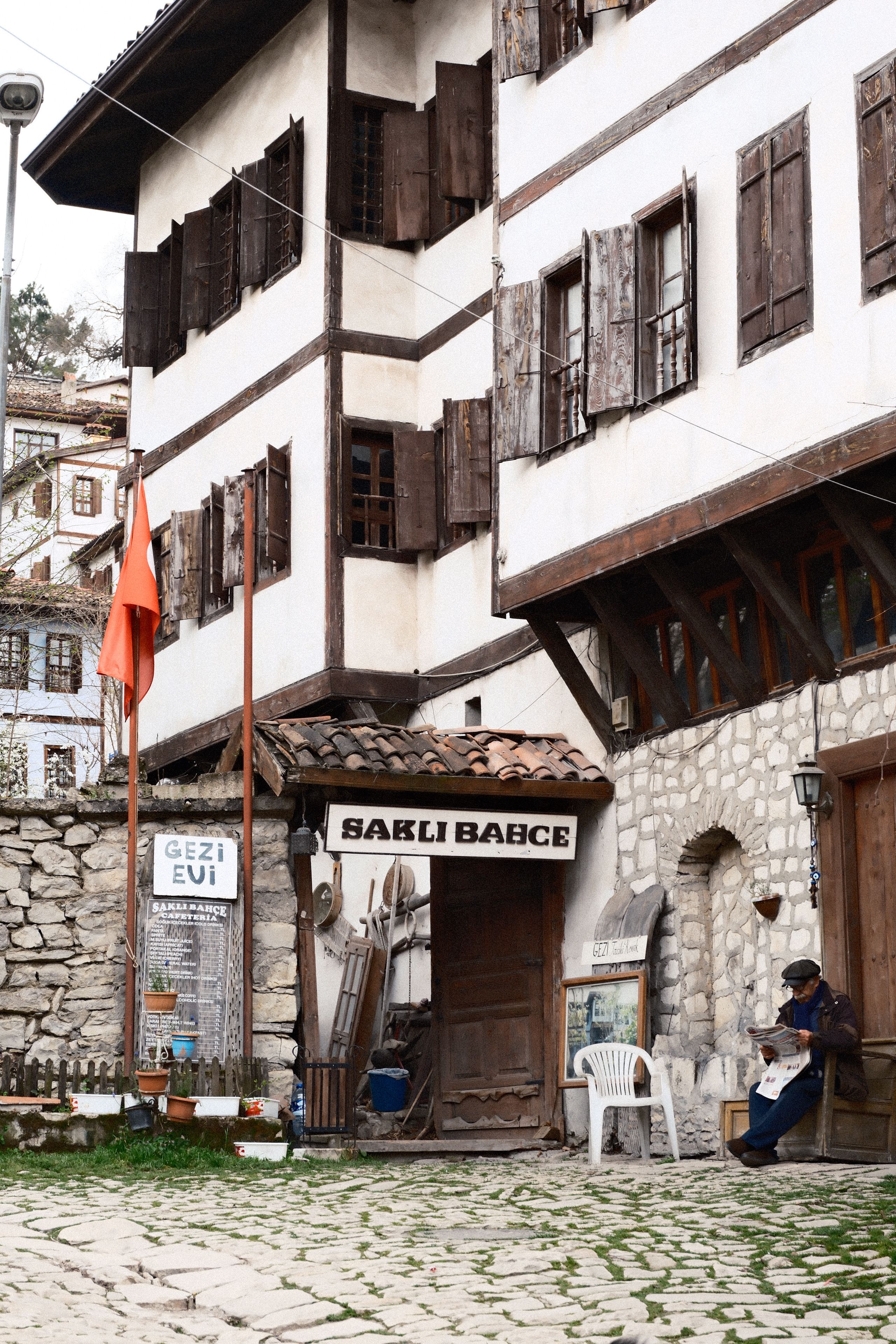 Historic Ottoman building facade in a Turkish village with a quiet street view.