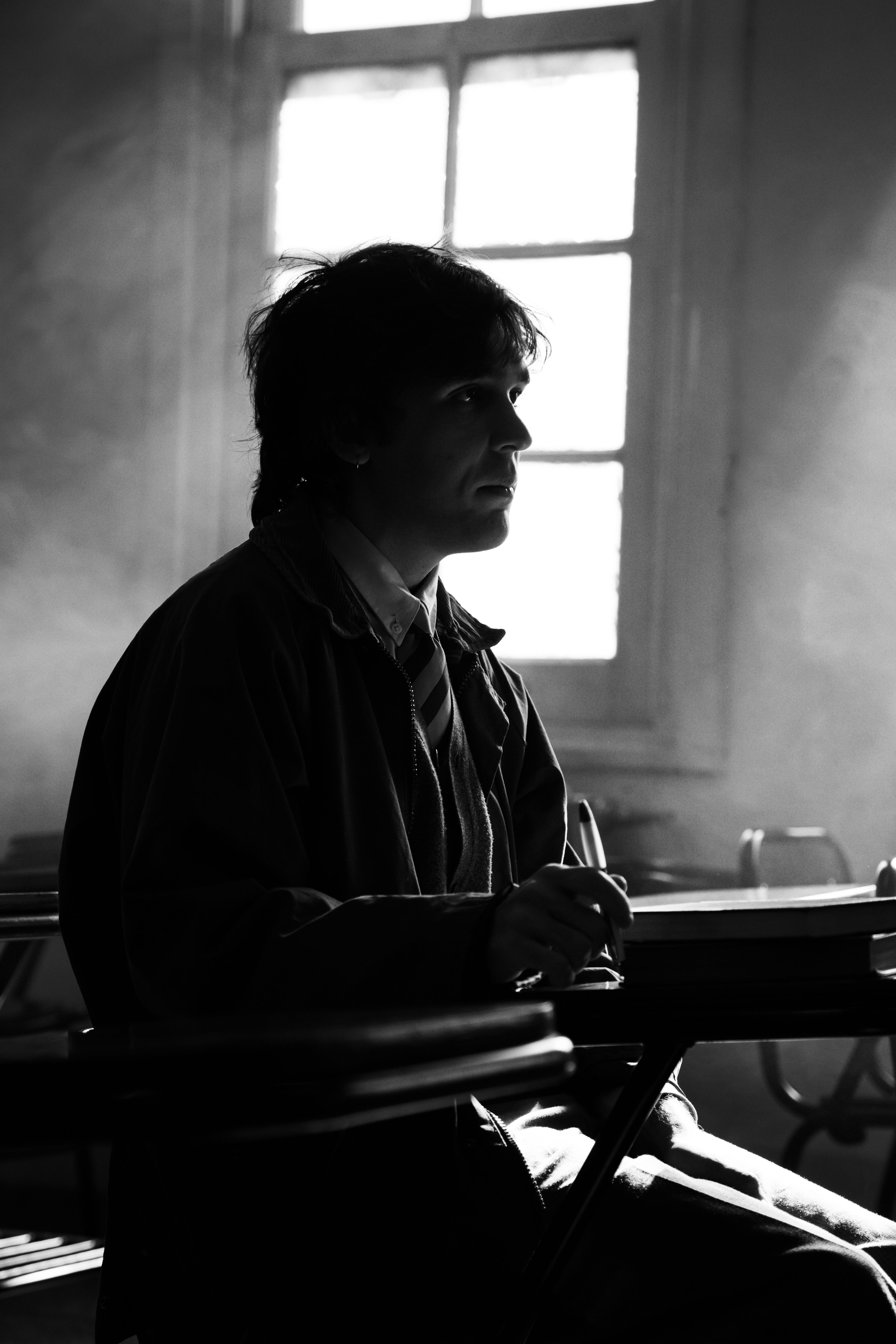 Silhouette of a male student in a vintage classroom, Buenos Aires.