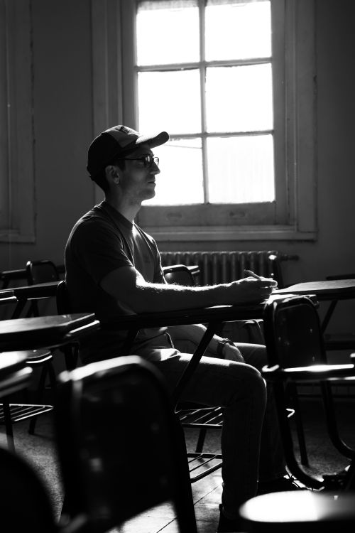 Free Captivating black and white image of a student in a university classroom in Buenos Aires. Stock Photo