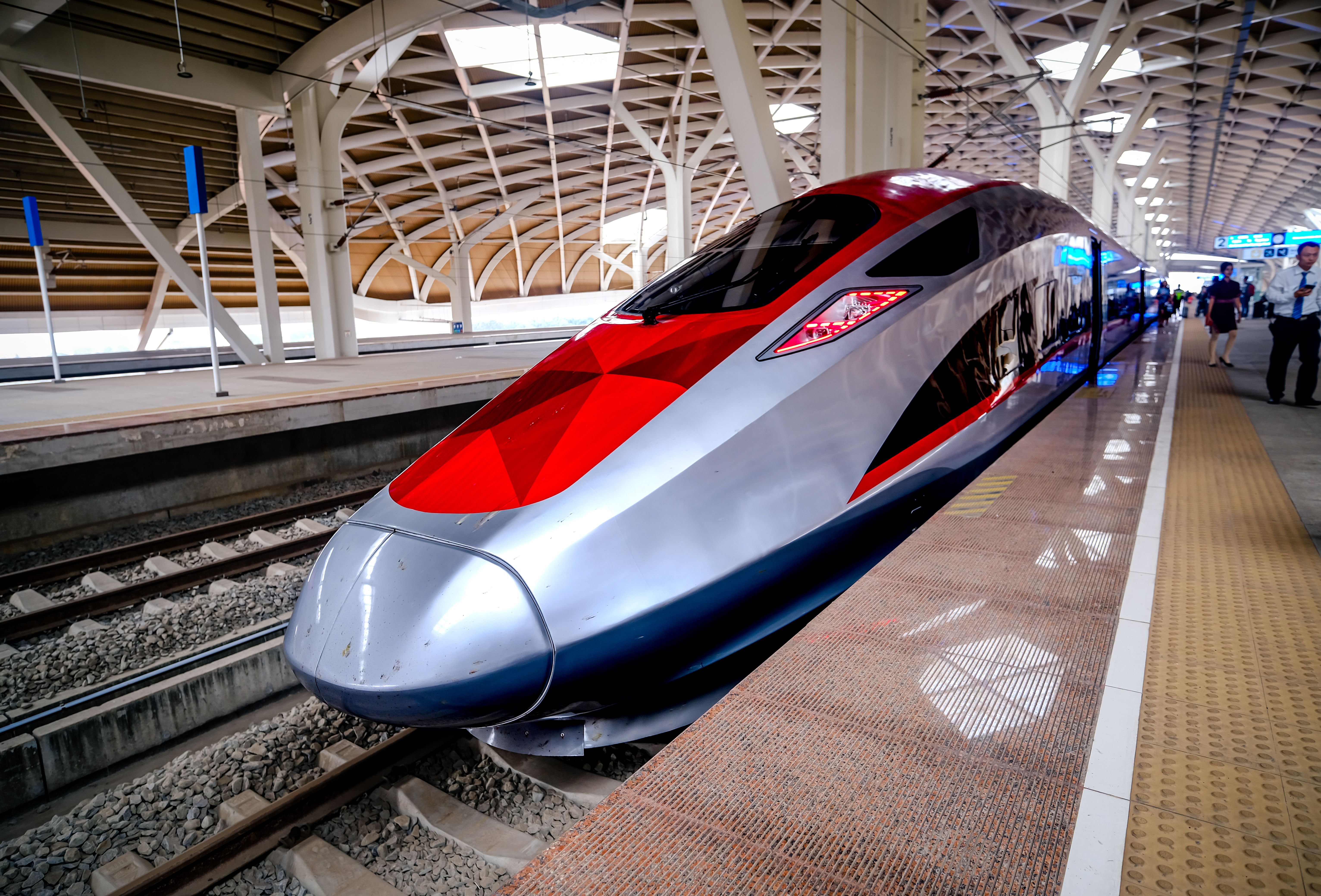 Modern high-speed train at station platform in Jakarta, Indonesia showcases sleek design and advanced transportation.