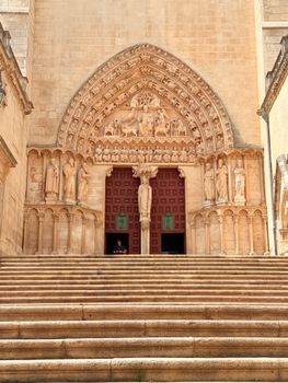Stunning stone carvings adorn the entrance of a Gothic cathedral in Burgos, Spain.