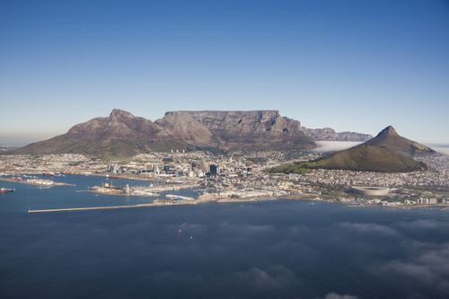 Free Stunning aerial view of Cape Town, featuring Table Mountain and the vibrant cityscape. Stock Photo