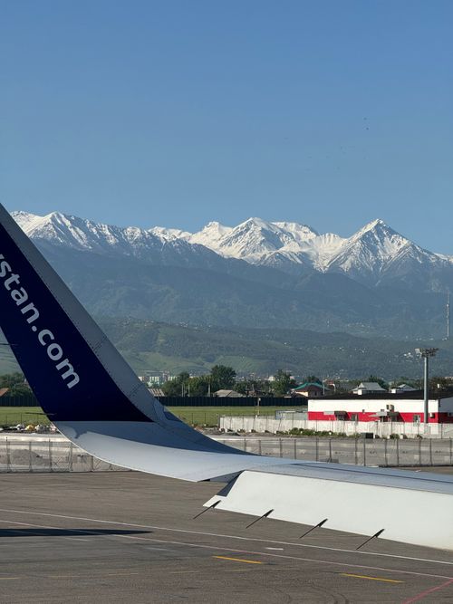 Free Stunning view of snow-capped mountains from an airplane at Almaty International Airport. Stock Photo