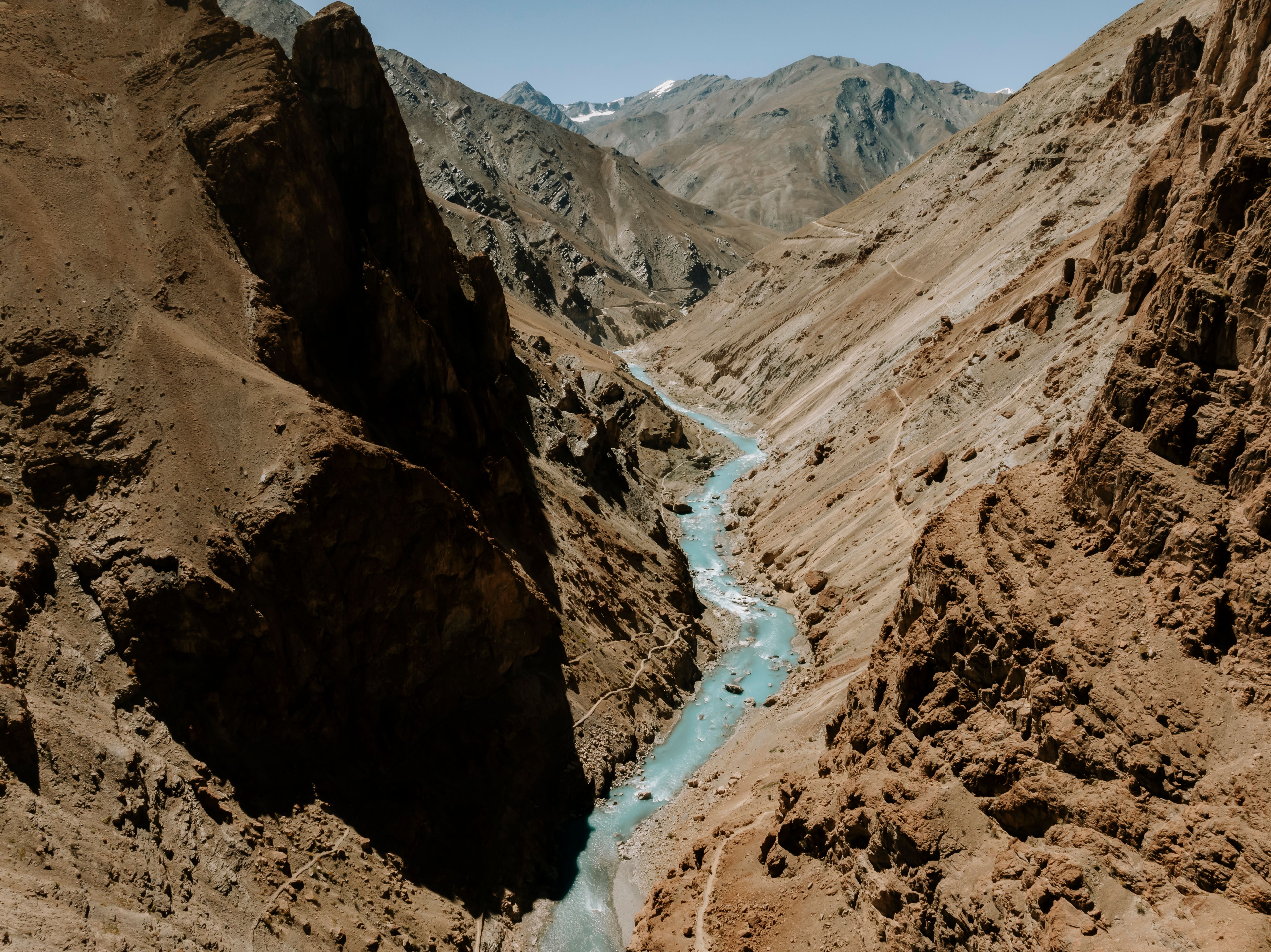 Trekkers on a scenic trail in the Indian Himalayas, emphasizing adventure sports coverage