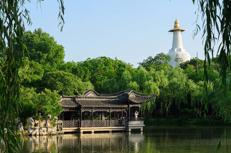 The White Dagoba above lakeside pavilions in Beihai Park, Beijing