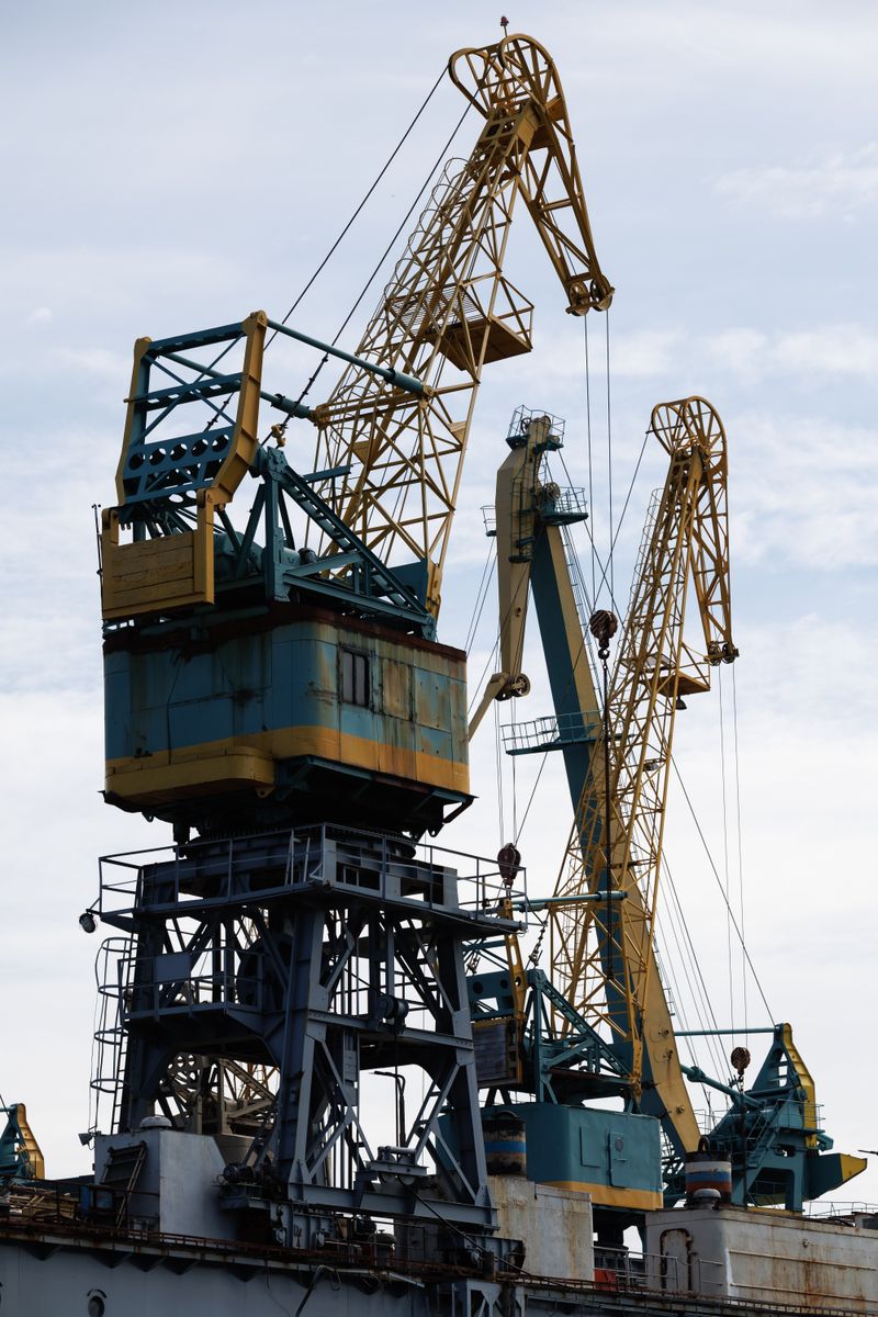 View of industrial cranes towering over a shipyard in Kaliningrad, Russia